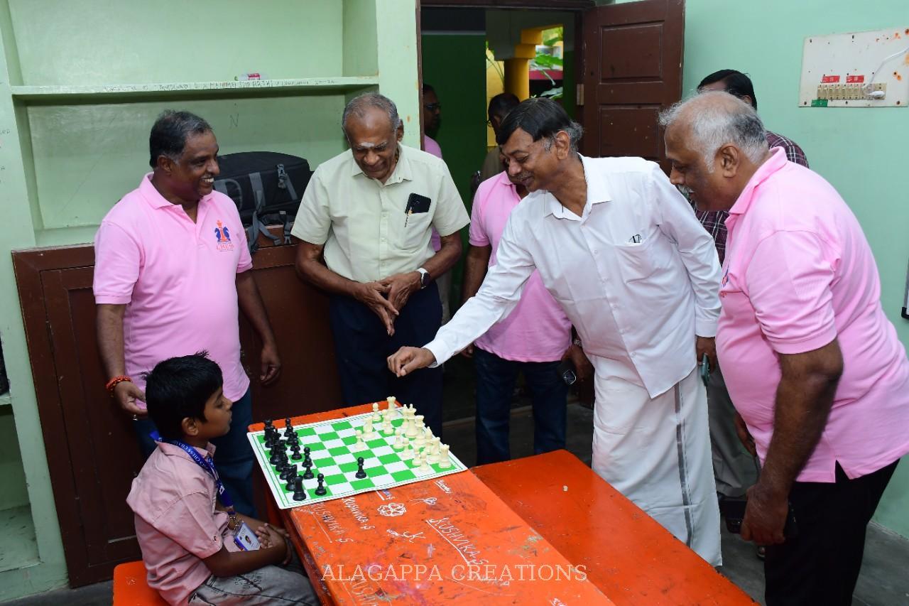 Organisers greeting a young player